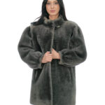 Sheepskin coat long sleeves narrow cuffs 50 cm long 80cm button at the neck piping