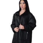Reversible black eco sheepskin coat 50 button closure clip on fur side and leather side zip pockets and mug